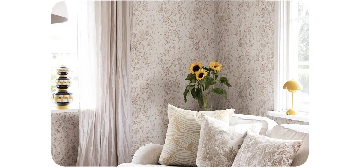 pink floral feminine wallpaper on the bedside of the living room